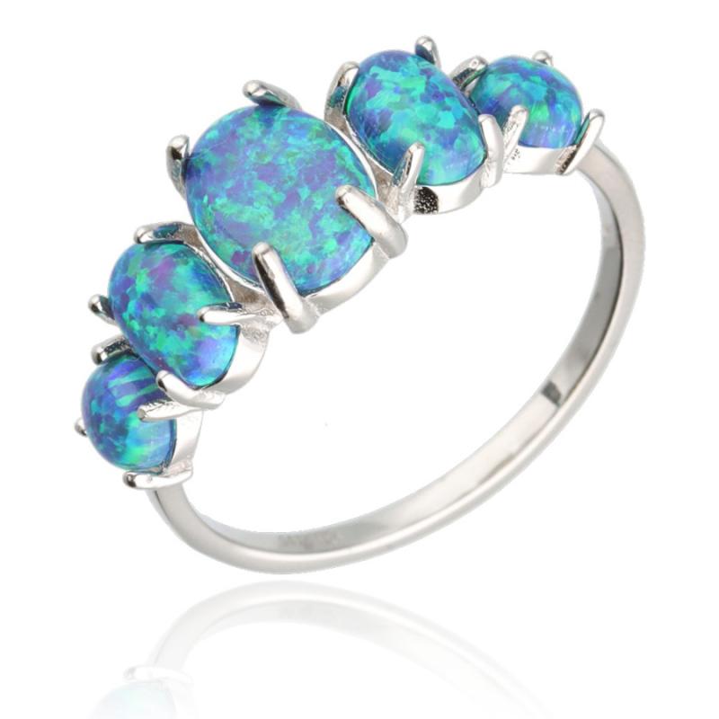 Stříbrný prsten - modré oválné syntetické opály | Argento.cz
