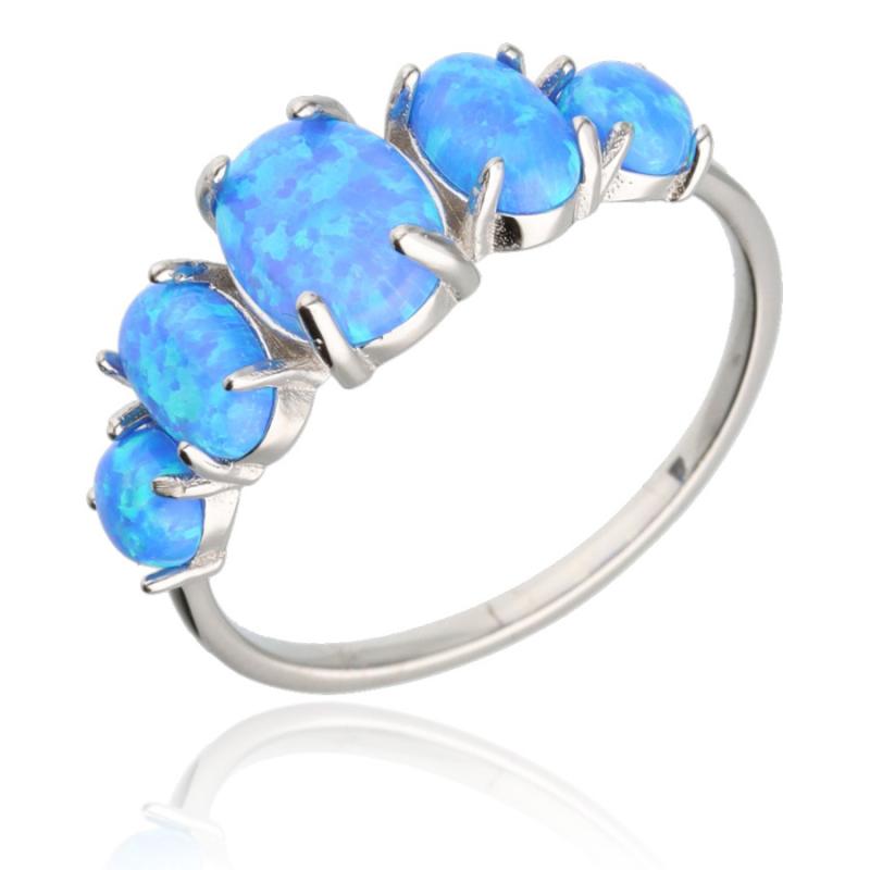 Stříbrný prsten - modré oválné syntetické opály | Argento.cz