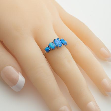 Stříbrný prsten - modré oválné syntetické opály | Argento.cz